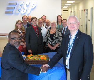 SSG President and CEO Calvin Mitchell, left, shakes hands with ESP President and CEO Doug Fouser