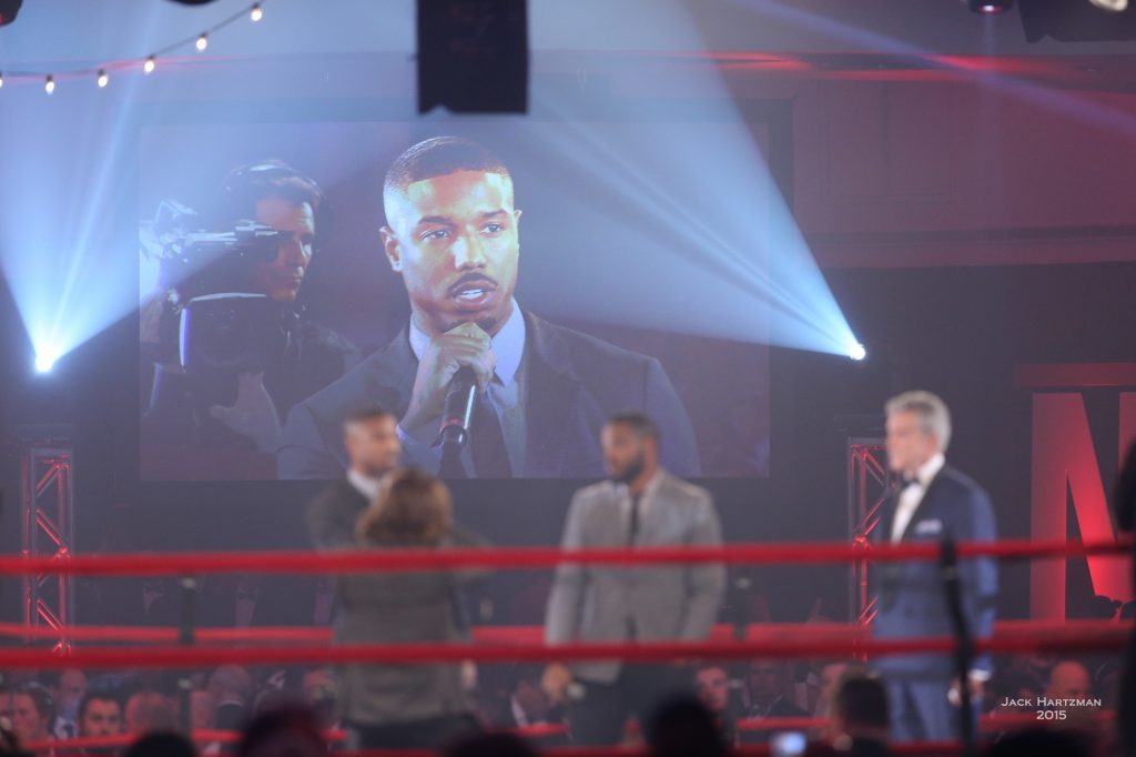 Actor Michael B. Jordan (speaking) and director Ryan Coogler from the upcoming movie CREED in the ring with announcer Michael Buffer to present commemorative robe to Fight For Children. Photo credit Jack Hartzman/Fight For Children
